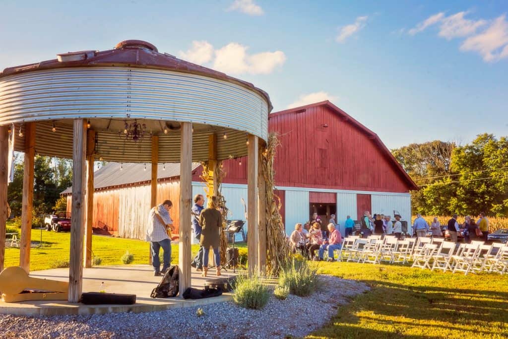 Micro wedding at the farm, under a canopy & next to a barn